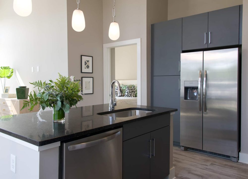 Interior kitchen with stainless steel appliances and kitchen island